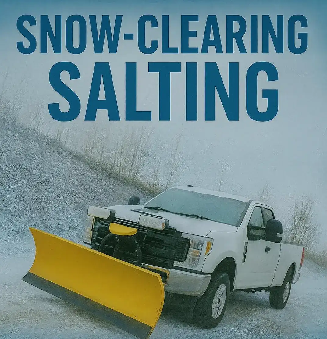 Truck spreading salt on a snowy driveway